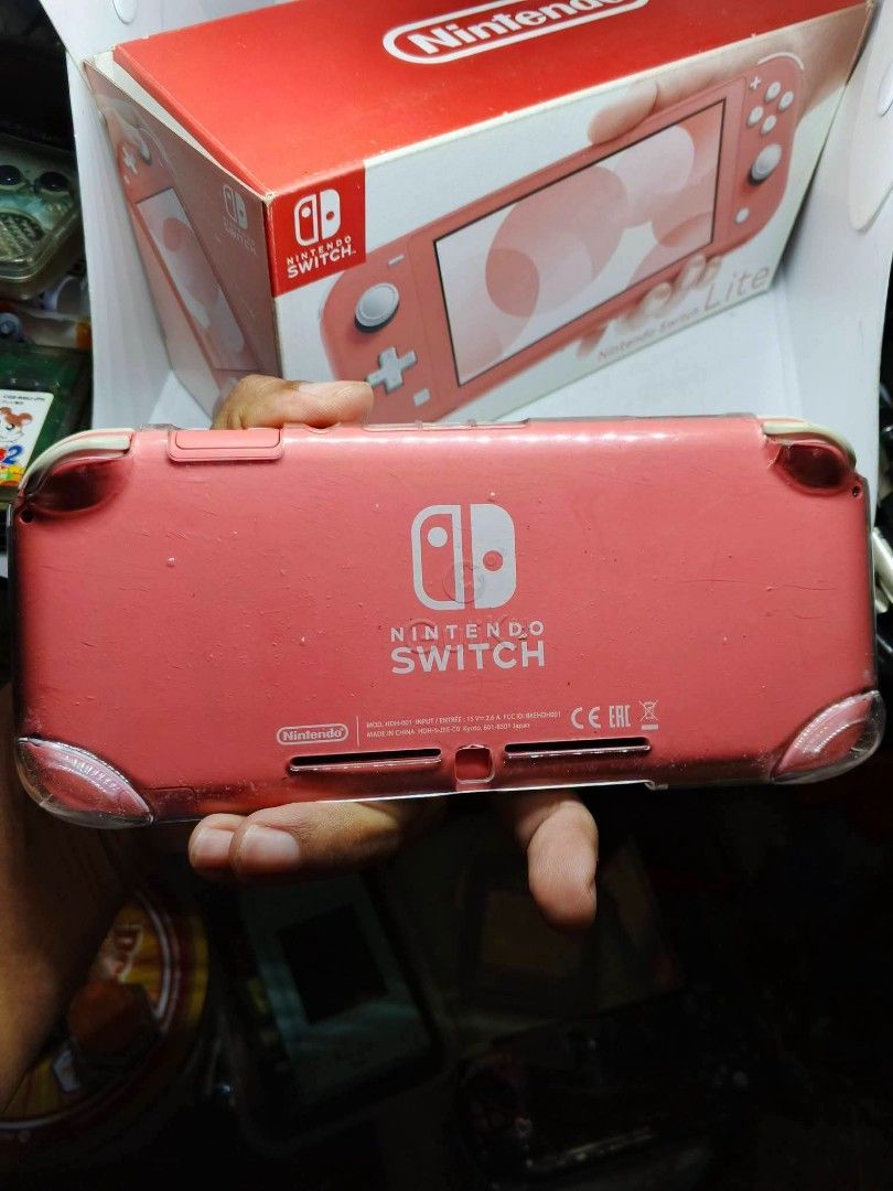 Nintendo switch lite (Category: Nintendo) located in Caloocan City. Submitted by grand_rabbit (Listing ID 1467152956, Image 2). Description: - Model: Nintendo Switch Lite - Color: Coral Pink - Condition: Good (7/10), tested and fully working - Inclusions: Original box and clear protective case - Design: Compact, lightweight handheld console ideal for travel and on-the-go gaming - Features: Integrated controls and bright screen display.
