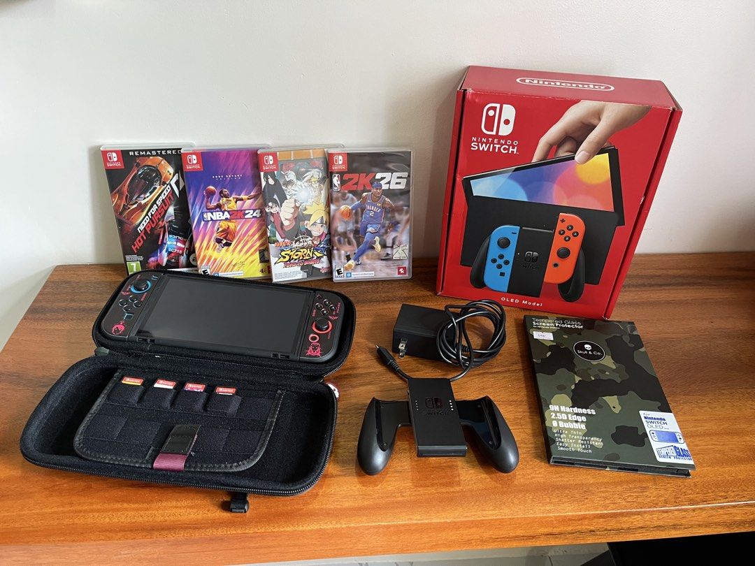 Nintendo Switch OLED Bundle (Category: Nintendo) located in Bacolod City. Submitted by ejdp_24 (Listing ID 1467108642, Image 1). Description: Nintendo Switch OLED Bundle ( Neon Blue and Red ) Complete accessories with box and games - Original Box - Dock ( Never been used 😅 ) - Original grip and straps ( Never used din ) - HDMI Cable and AC Adapter - Skull & Co. Protective Case Games: - Need for Speed: Hot Pursuit Remastered - NBA 2K24 - Naruto S