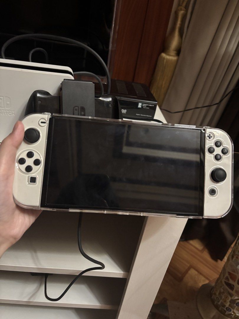 Nintendo Switch Oled White (Category: Nintendo) located in Batangas. Submitted by madsss.tree (Listing ID 1467125448, Image 1). Description: Nintendo Switch Oled White For Sale!! Rush Sale!! 14k Negotiable includes: 2 games: - Mario Kart - Super Mario Party With clear case Controller holder No sd card No box Payment: Online Cash Delivery: Meetup: around Batangas Delivery: sf will be handled by the buyer .