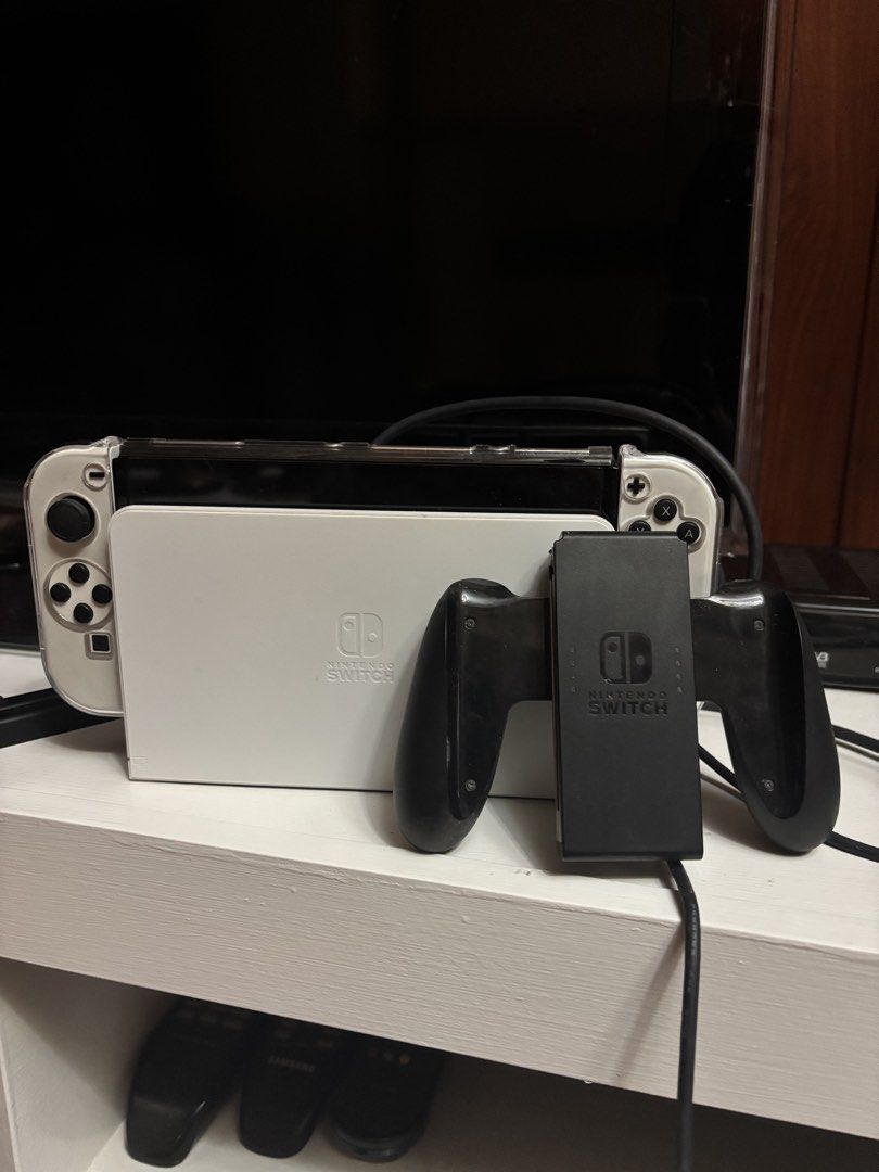 Nintendo Switch Oled White (Category: Nintendo) located in Batangas. Submitted by madsss.tree (Listing ID 1467125448, Image 2). Description: Nintendo Switch Oled White For Sale!! Rush Sale!! 14k Negotiable includes: 2 games: - Mario Kart - Super Mario Party With clear case Controller holder No sd card No box Payment: Online Cash Delivery: Meetup: around Batangas Delivery: sf will be handled by the buyer .