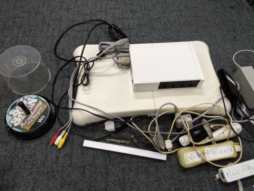 Nintendo Wii Console Bundle with Balance Board and Games (Category: Nintendo) located in Taguig. Submitted by choiisexyy (Listing ID 1466972887, Image 1). Description: - Complete white Nintendo Wii console bundle, fully tested and working - Includes Nintendo Balance Board for active fitness games - Comes with 2 Wii Remotes (with protective silicone sleeves) and 1 Nunchuk - Includes sensor bar, power adapters, and AV cables - Bonus game included: 