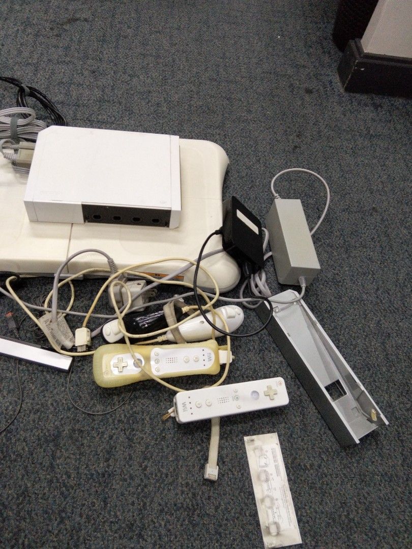 Nintendo Wii Console Bundle with Balance Board and Games (Category: Nintendo) located in Taguig. Submitted by choiisexyy (Listing ID 1466972887, Image 2). Description: - Complete white Nintendo Wii console bundle, fully tested and working - Includes Nintendo Balance Board for active fitness games - Comes with 2 Wii Remotes (with protective silicone sleeves) and 1 Nunchuk - Includes sensor bar, power adapters, and AV cables - Bonus game included: 