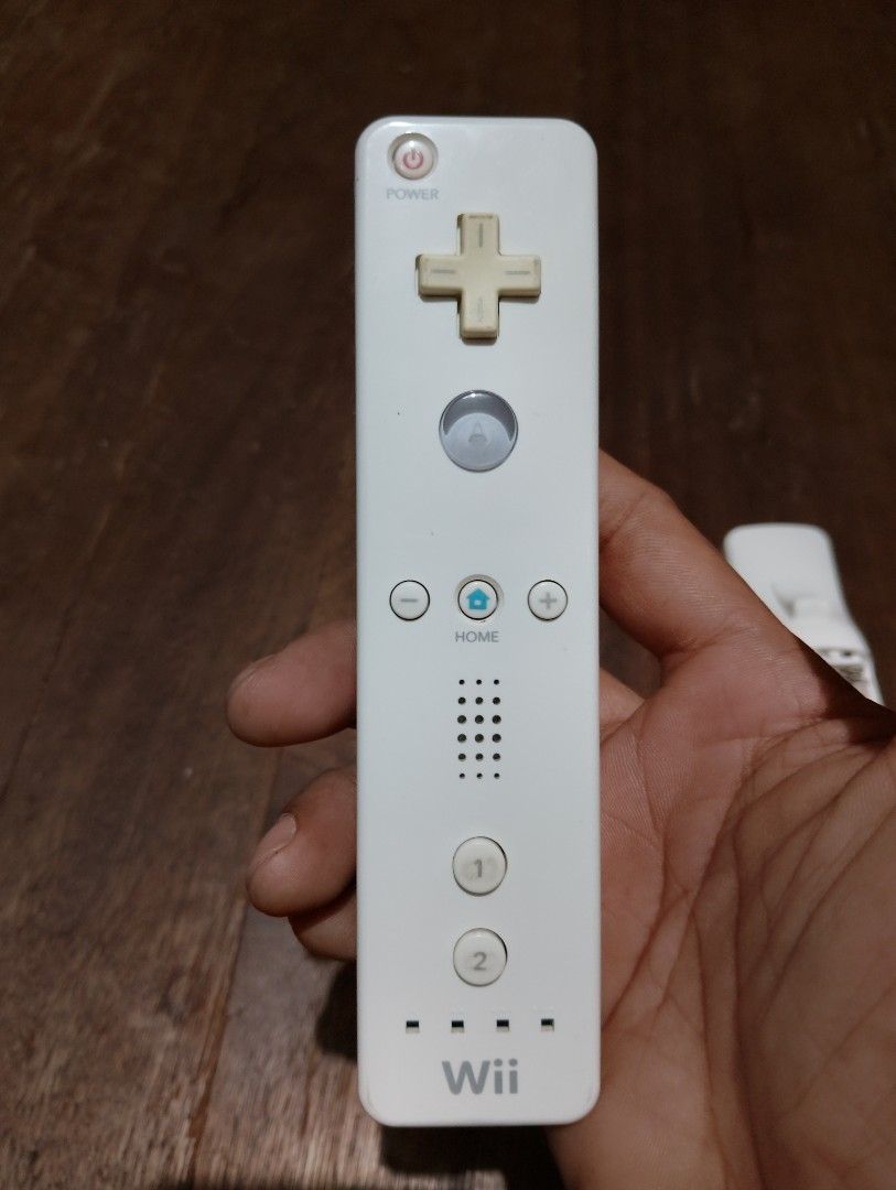 Nintendo Wii Remote Controllers Pair (Category: Controllers) located in Manila. Submitted by boyhet.thrift15 (Listing ID 1467114211, Image 3). Description: - Set of 2 original Nintendo Wii Remotes (Model RVL-003) - selling as is condition no unit for testing ung motion controller - ung clone controller lang ung gumagana sa battery ung orig. controller ayaw gumana for repair or parts out. - selling 400.
