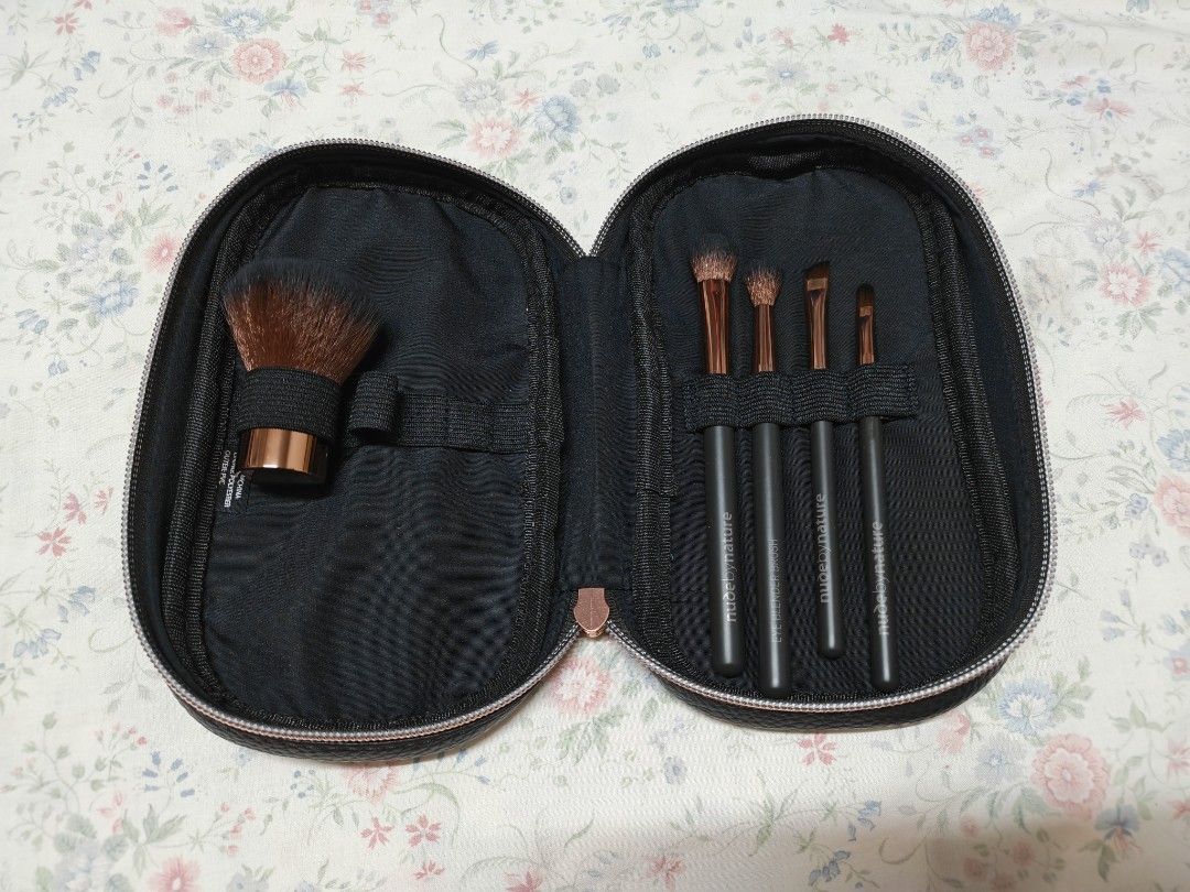 Nude by Nature Essential Collection 5pc Brush Set with Case (Category: Makeup) located in Pasig City. Submitted by she_declutters_ph (Listing ID 1467106270, Image 3). Description: - Brand: Nude by Nature - Set includes: 1 large face brush and 4 eye brushes - Design: Charcoal grey handles with rose gold ferrules - Storage: Comes with a sleek black zippered pouch featuring rose gold hardware, structured lining, and secure elastic loops - Condition: