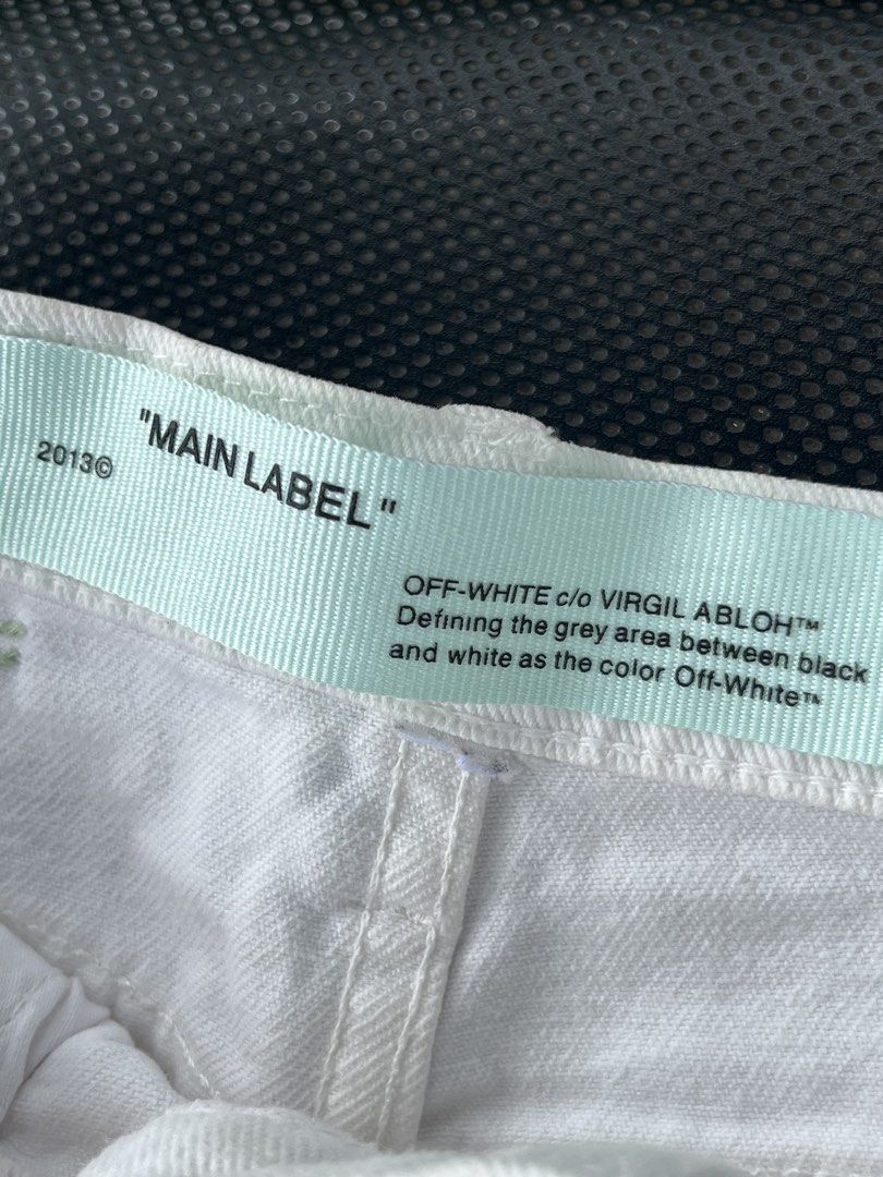 Off-White White Denim Shorts Size 38 Size Small (Category: Shorts) located in Tacloban City. Submitted by luxbag_phhh (Listing ID 1467006593, Image 3). Description: - Brand: Off-White Authentic - Color: White with bold black 'WHITE' lettering - Size: 38 (Interior tag) size Small - Material: 100% polyester denim fabric - Design: Raw frayed hem, signature mint green interior/exterior labels, branded metal buttons and rivets - Condition: Excellent p