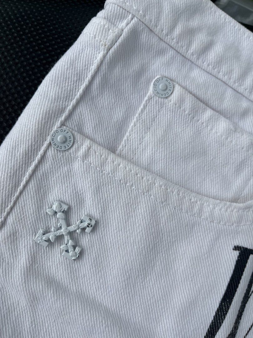 Off-White White Denim Shorts Size 38 Size Small (Category: Shorts) located in Tacloban City. Submitted by luxbag_phhh (Listing ID 1467006593, Image 2). Description: - Brand: Off-White Authentic - Color: White with bold black 'WHITE' lettering - Size: 38 (Interior tag) size Small - Material: 100% polyester denim fabric - Design: Raw frayed hem, signature mint green interior/exterior labels, branded metal buttons and rivets - Condition: Excellent p