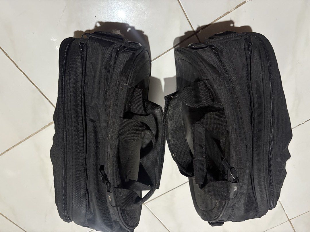 Ogio Motorcycle Saddle Bag Pair (Category: Helmets and other Riding Gears) located in Manila. Submitted by gentlecloud_71412b (Listing ID 1467166333, Image 2). Description: - Brand: Ogio - Color: Black - Condition: Good, normal signs of previous mounting use - Features: Durable construction with molded side panels and branded logo inserts - Convenience: Sturdy carry handles and built-in rain hood compartments on the zippers - Capacity: Great stor