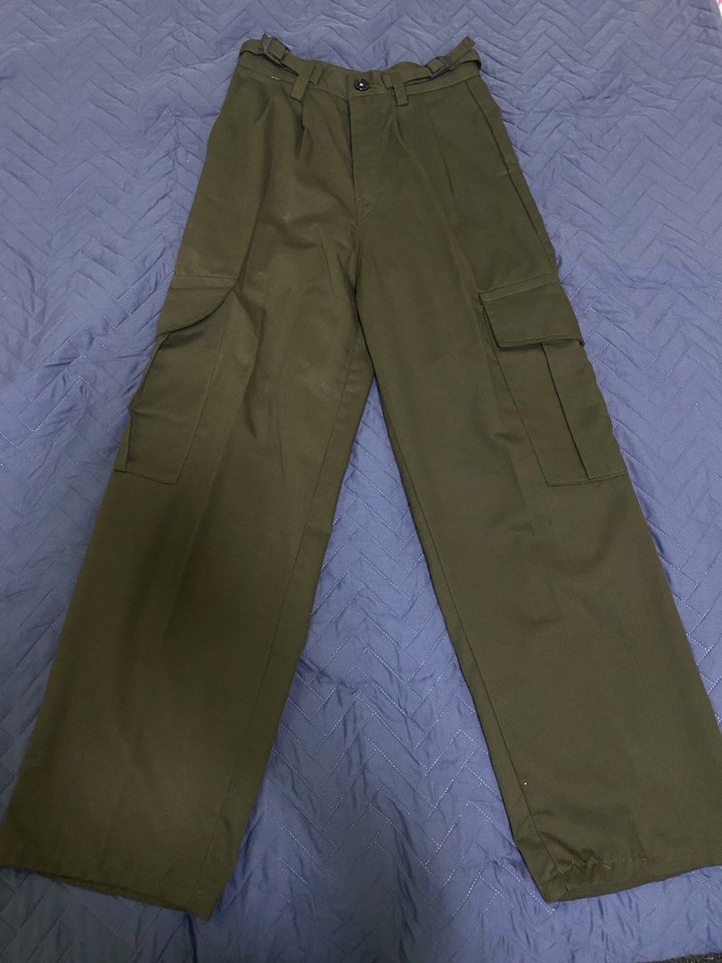 Olive Green Cargo Pants with Adjustable Waist Buckles (Category: Jeans) located in Manila. Submitted by escherichiaa (Listing ID 1467116401, Image 1). Description: - Color: Olive green - Fit: Wide leg with front pleats - Details: Utility pockets on sides and back, adjustable side waist buckles - Closure: Button closure - Material: Sturdy twill fabric - Condition: Excellent, clean with no flaws.