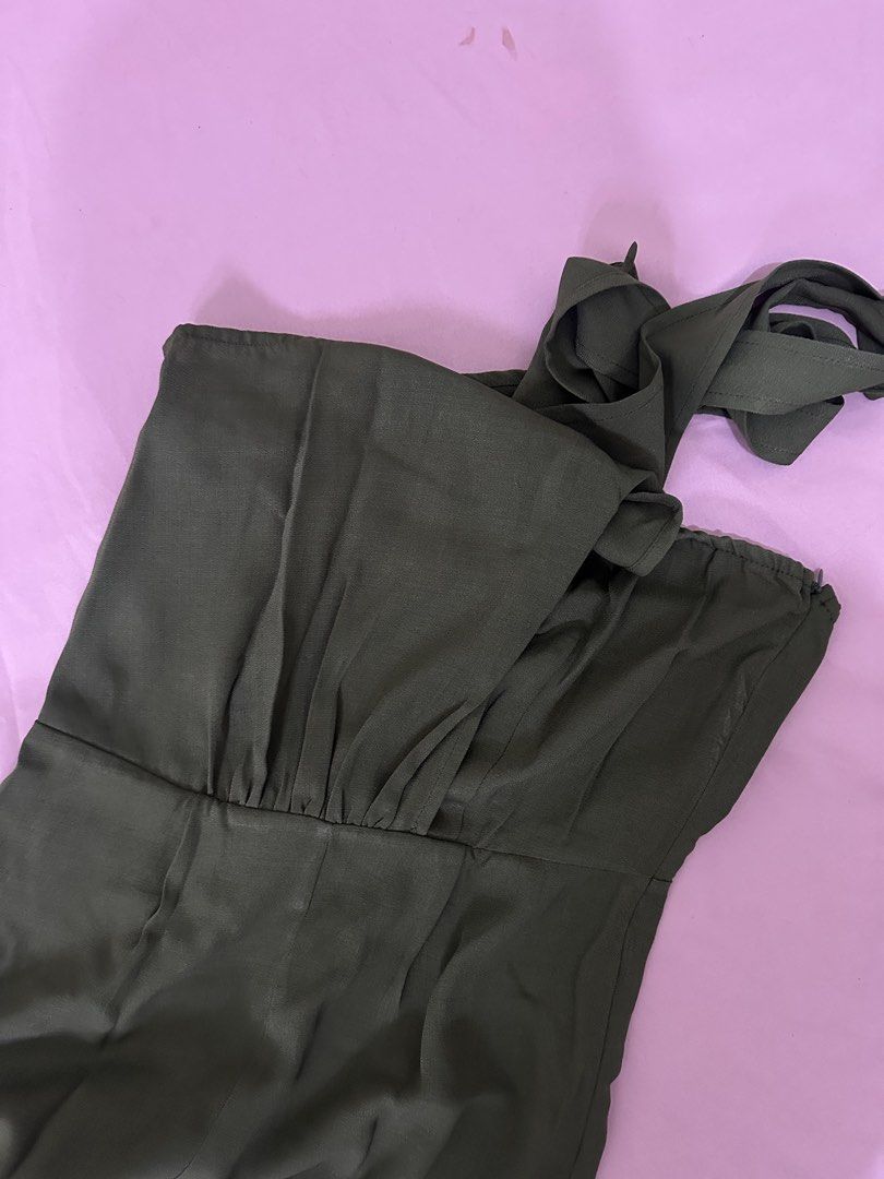Olive Green One-Shoulder Romper with Bow Detail (Category: Rompers) located in Caloocan City. Submitted by nikkiepie704949 (Listing ID 1466974549, Image 2). Description: - Color: Olive green - Style: One-shoulder with tied bow strap, pleated front bodice, and built-in shorts - Material: Lightweight and comfortable - Condition: Worn a few times, washed, and ready to ship.