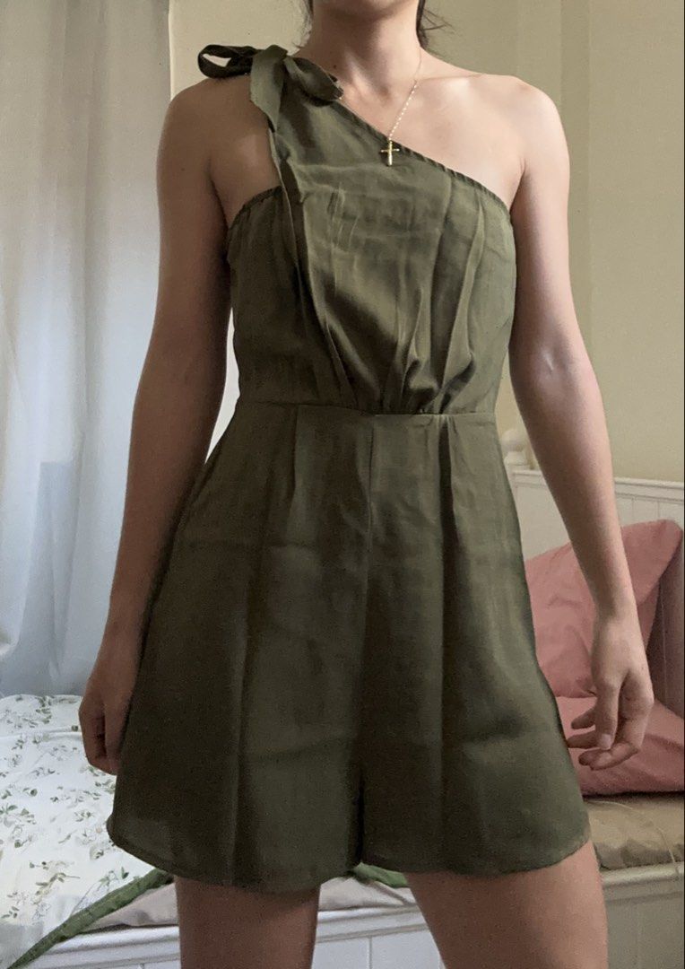 Olive Green One-Shoulder Romper with Bow Detail (Category: Rompers) located in Caloocan City. Submitted by nikkiepie704949 (Listing ID 1466974549, Image 1). Description: - Color: Olive green - Style: One-shoulder with tied bow strap, pleated front bodice, and built-in shorts - Material: Lightweight and comfortable - Condition: Worn a few times, washed, and ready to ship.