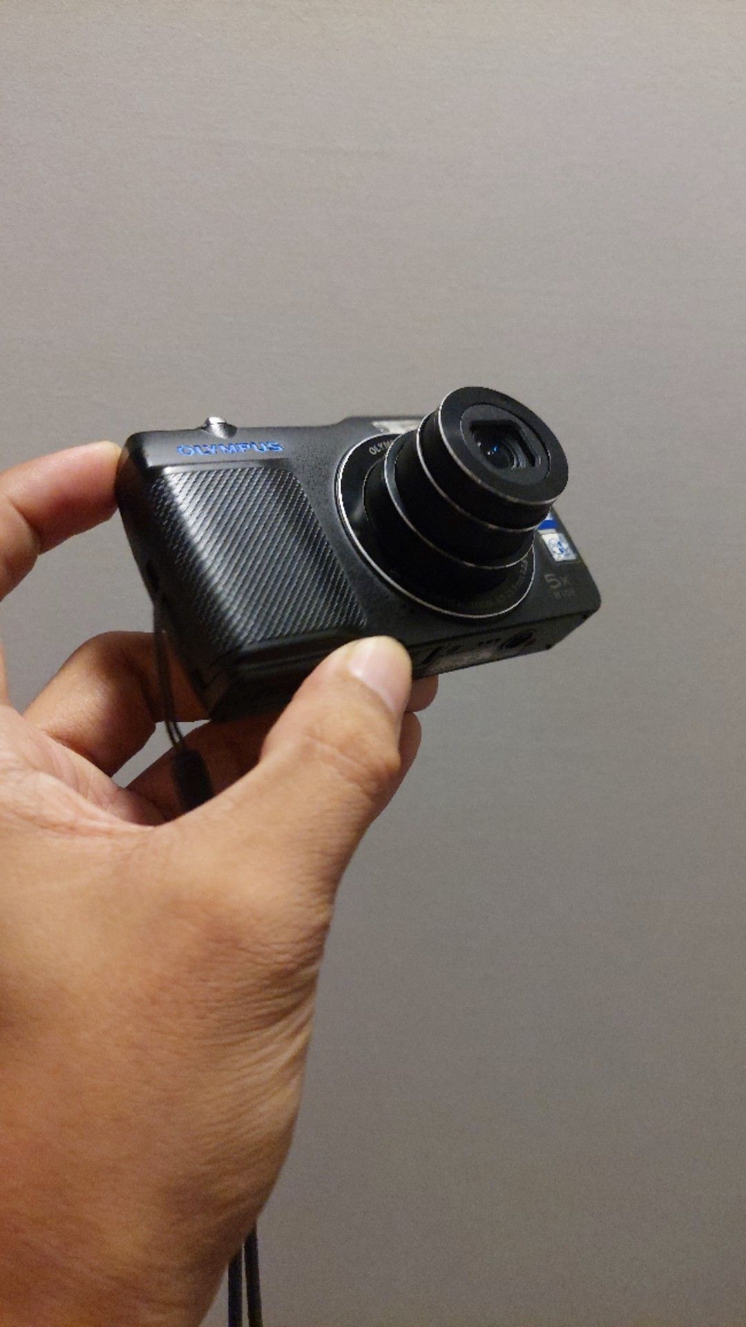 Olympus VG 170 digital camera black with strap (Category: Cameras) located in Manila. Submitted by lesterjohn17980 (Listing ID 1467164011, Image 1). Description: - Brand: Olympus digital camera - Color: Classic black with textured front grip - Lens: 5x wide optical zoom - Display: Working LCD screen with clear image display - Design: Compact and pocket-friendly body - Inclusions: Attached wrist strap for safety.