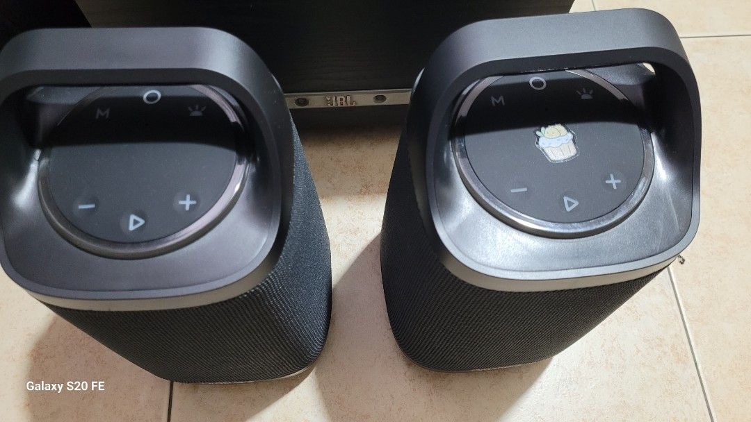 Orashare BS21 Bluetooth Speakers Pair (Category: Soundbars, Speakers & Amplifiers) located in Quezon City. Submitted by b791n47g55 (Listing ID 1466999987, Image 3). Description: Selling for 4000.00 Two Orashare bs21 black wireless speakers with built-in handles. Top panel has playback controls, volume buttons, and mode switches. Rubberized ports on the back for mic, aux, and USB connections. One speaker has a small decorative sticker on top. Both