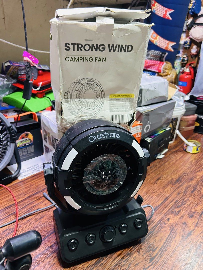 Orashare Strong Wind Camping Fan with LED Light (Category: Fans) located in Manila. Submitted by starbalesukandjapansurplus (Listing ID 1466977858, Image 1). Description: - Brand: Orashare camping fan in stylish black - Build: Heavy-duty and durable construction - Lighting: Built-in LED ring light around the fan head - Controls: Multi-function control knobs located on the base - Battery: Massive 20000mAh capacity (per packaging) - Condition: Incl