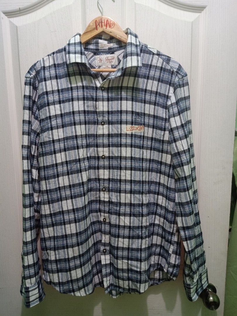 Original Penguin Plaid Long Sleeve Button-Down Shirt (Category: Tshirts & Polo Shirts ) located in Cavite. Submitted by nigo1993 (Listing ID 1467089270, Image 1). Description: - Brand: Original Penguin - Design: Classic plaid in blue, white, and black - Size: Large (Standard fit) - Measurements: 22 inches across the chest, 29 inches in length - Details: Button-down front with a standard collar - Condition: Great casual piece for everyday wear.