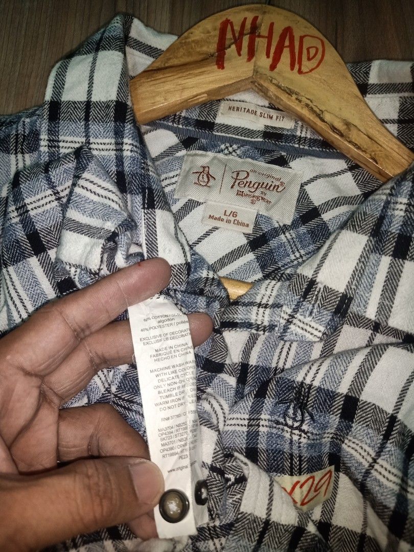 Original Penguin Plaid Long Sleeve Button-Down Shirt (Category: Tshirts & Polo Shirts ) located in Cavite. Submitted by nigo1993 (Listing ID 1467089270, Image 2). Description: - Brand: Original Penguin - Design: Classic plaid in blue, white, and black - Size: Large (Standard fit) - Measurements: 22 inches across the chest, 29 inches in length - Details: Button-down front with a standard collar - Condition: Great casual piece for everyday wear.