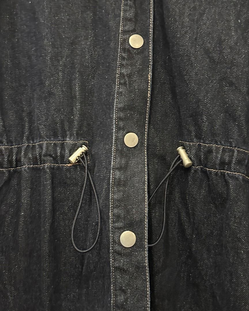 Oversized Dark Denim Jacket with Drawstring Waist from Japan (Category: Coats, Jackets and Outerwear) located in Pasig City. Submitted by p.re.loved (Listing ID 1467054884, Image 2). Description: - Color: Dark blue - Fit: Trendy oversized fit - Material: Sturdy denim with visible contrast stitching - Closure: Button-down front with metallic buttons and classic lapel collar - Special Feature: Adjustable drawstring waist with black cords and metal 