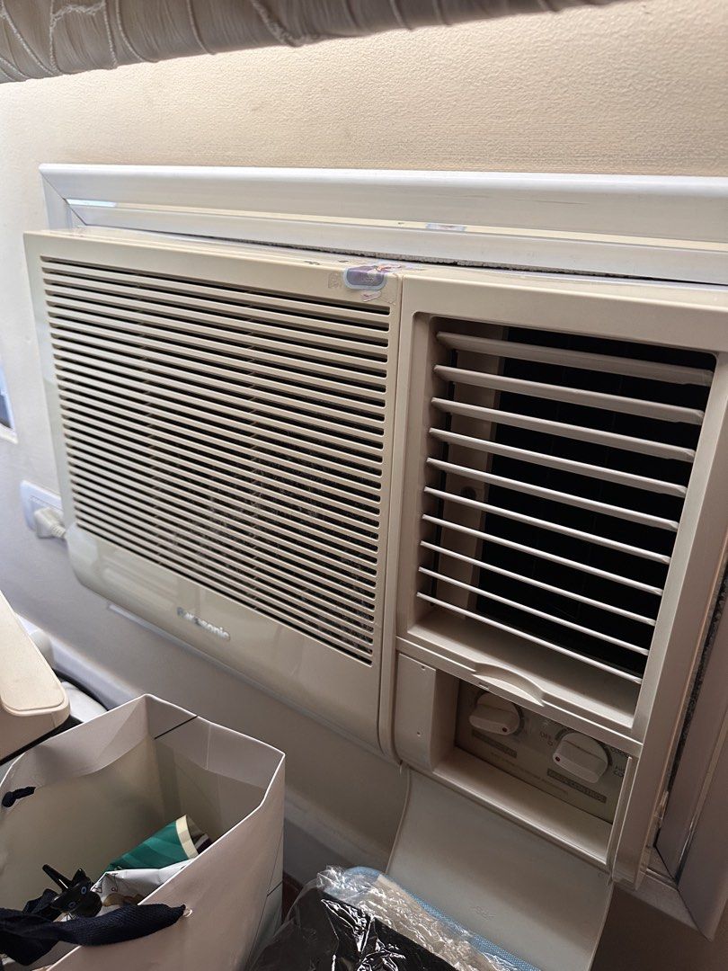 Panasonic Window Type Air Conditioner (Category: Air Conditioning and Heating) located in Manila. Submitted by suartina2093025 (Listing ID 1466970946, Image 1). Description: - Brand: Panasonic window unit air conditioner - Color: Cream with front louvers - Controls: Dual rotary manual knobs at the bottom right for easy adjustment - Condition: Runs well and cools rooms effectively - Reason for selling: Moving out soon, need to clear out.