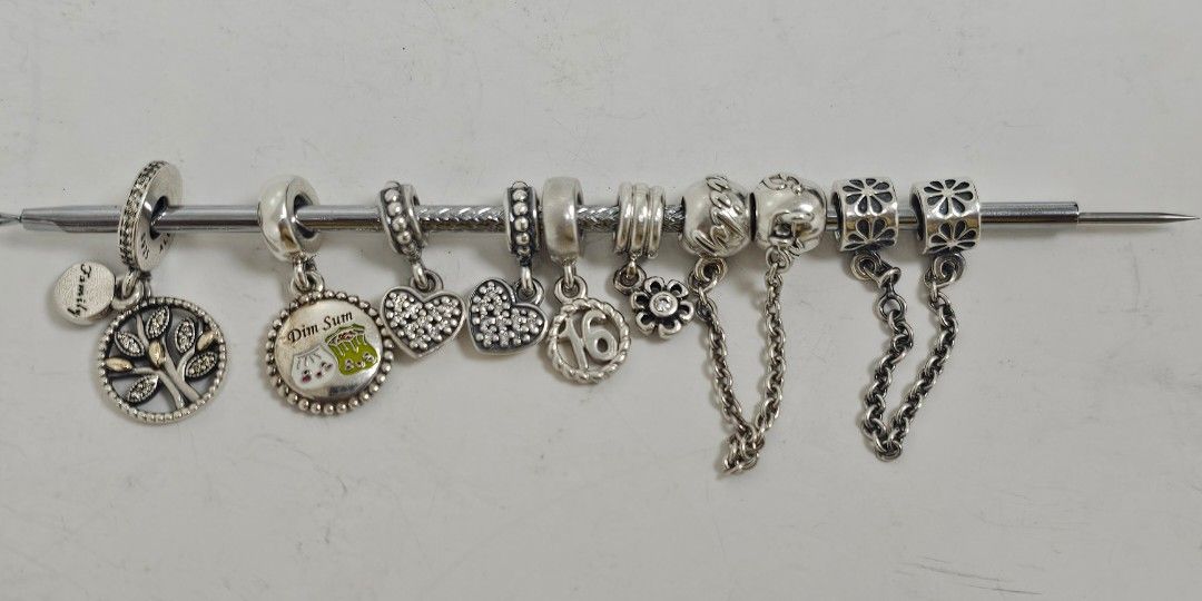 Pandora charms and dangle (Category: Charms) located in Manila. Submitted by onlinesmartshopping12 (Listing ID 1467101921, Image 1). Description: all original mix of new and preloved but pass as new new keep safe with rosegold - 1800 new Taiwan sioma travel -2500 preloved mm two tone 14k family dangle - 2200 family safety chain - 2500 heart dangle 2pcs - 2500 rib clips 2 pcs - 2500 trinity spacers 2 pcs - 2500 pink stone - 1500 pink stone clip - 