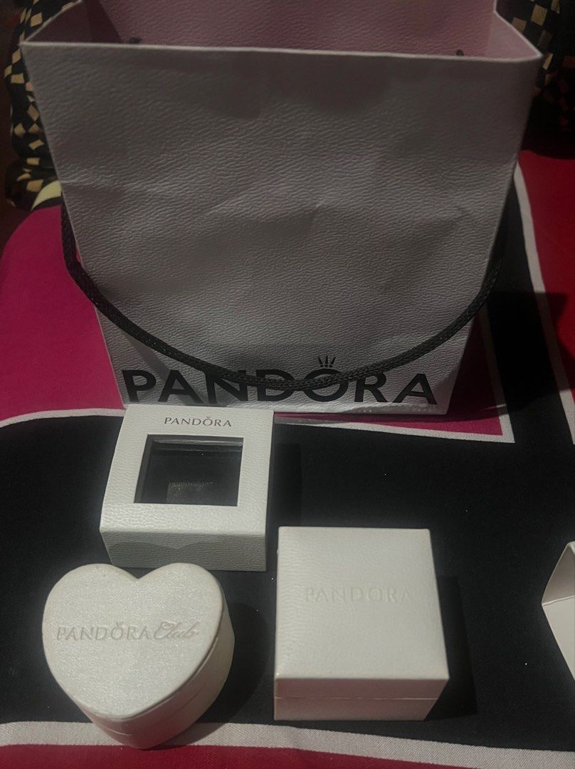 Pandora gift bag, ring boxes and heart box (Category: Accessory Holder, Box & Organizers) located in Caloocan City. Submitted by glamorouslysexy (Listing ID 1466987095, Image 1). Description: - 100% authentic Pandora packaging set - Includes 1 paper gift bag, 2 square (1 with window - ring / charm boxes, and 1 heart-shaped Club box - Soft black velvet interiors to keep your jewelry safe and secure .