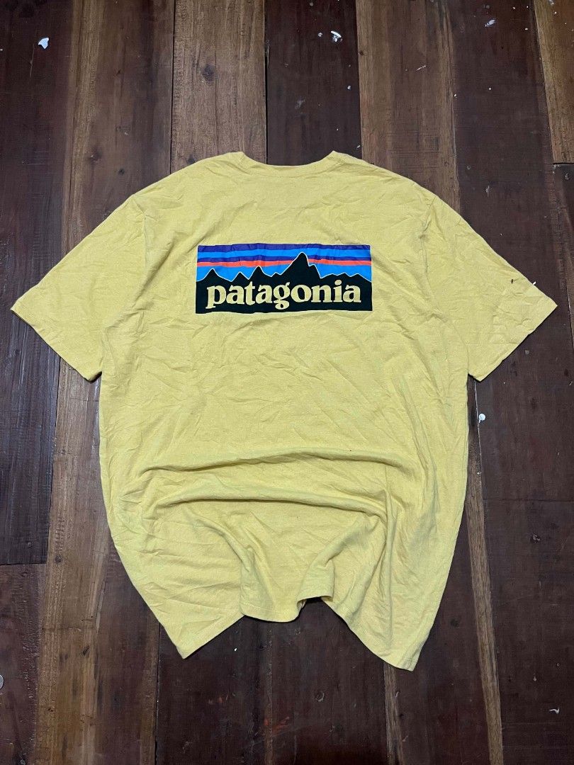Patagonia Yellow Responsibili-Tee Size L (Category: Tshirts & Polo Shirts ) located in Manila. Submitted by adzwilnams67005 (Listing ID 1467124677, Image 2). Description: - Brand: Patagonia Responsibili-Tee - Color: Mustard Yellow - Size: Large (Regular Fit) - Design: Classic Fitz Roy back graphic with small front chest logo - Material: Sustainable blend of recycled cotton and recycled polyester - Condition: Light fading and minor pilling from re