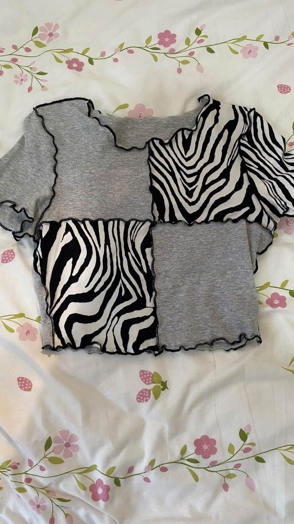 Patchwork Zebra and Grey Crop Top Y2K (Category: Sleeveless) located in Caloocan City. Submitted by lianarchiveee (Listing ID 1467091952, Image 1). Description: - Grey and black zebra print patchwork crop top - Short sleeves with trendy exposed lettuce edge seams - Soft and stretchy material for all-day comfort - Fits true to size - Perfect for casual street style outfits.