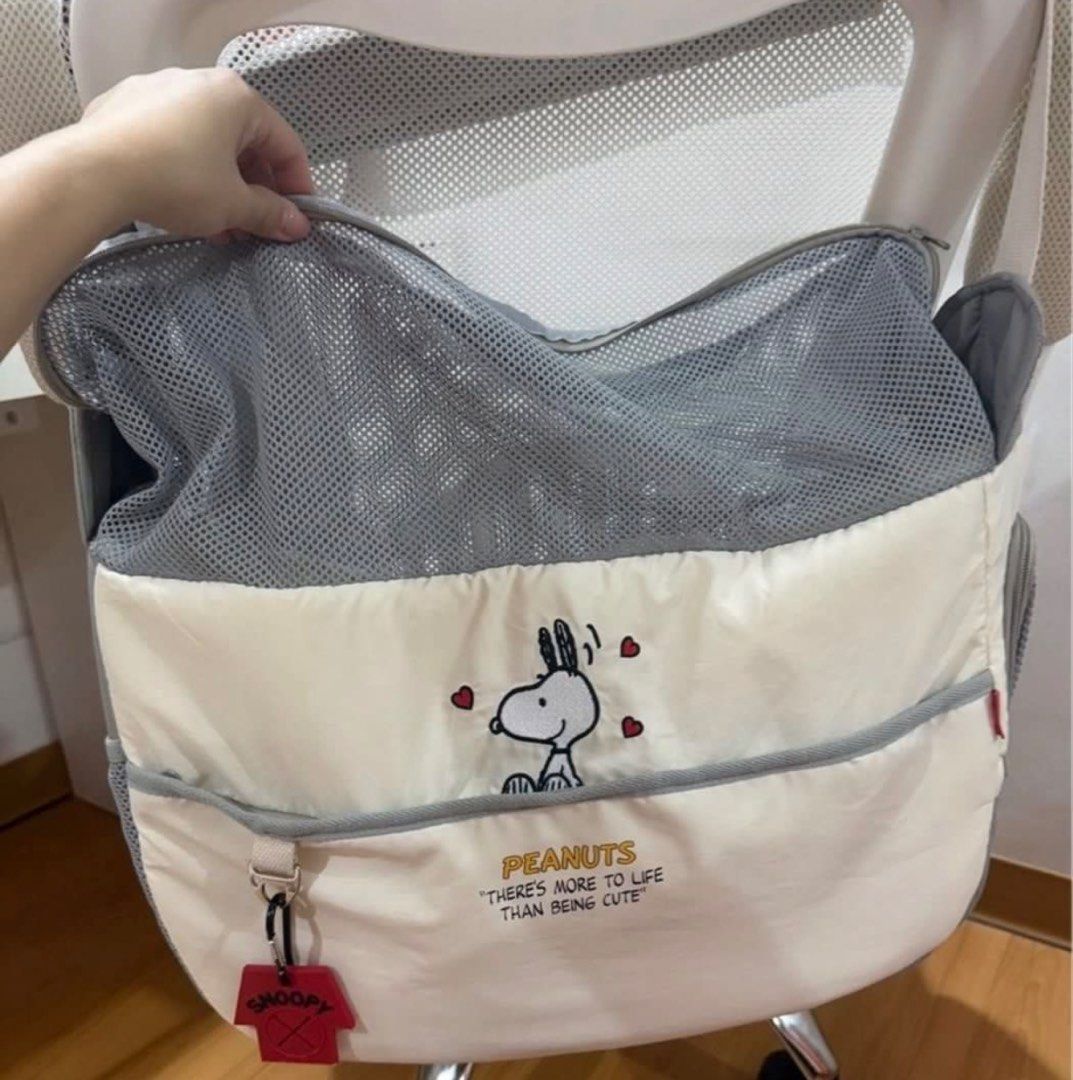 Peanuts Snoopy Pet Carrier Sling Bag Mesh (Category: Homes & Other Pet Accessories) located in Rizal. Submitted by matchapeppernacho (Listing ID 1467006242, Image 2). Description: - Authentic Peanuts pet carrier featuring an adorable Snoopy graphic and little red heart prints - Stylish off-white and grey color scheme suitable for everyday travel - Breathable grey mesh top section with secure zipper closure to keep your pet cool - Includes a remov