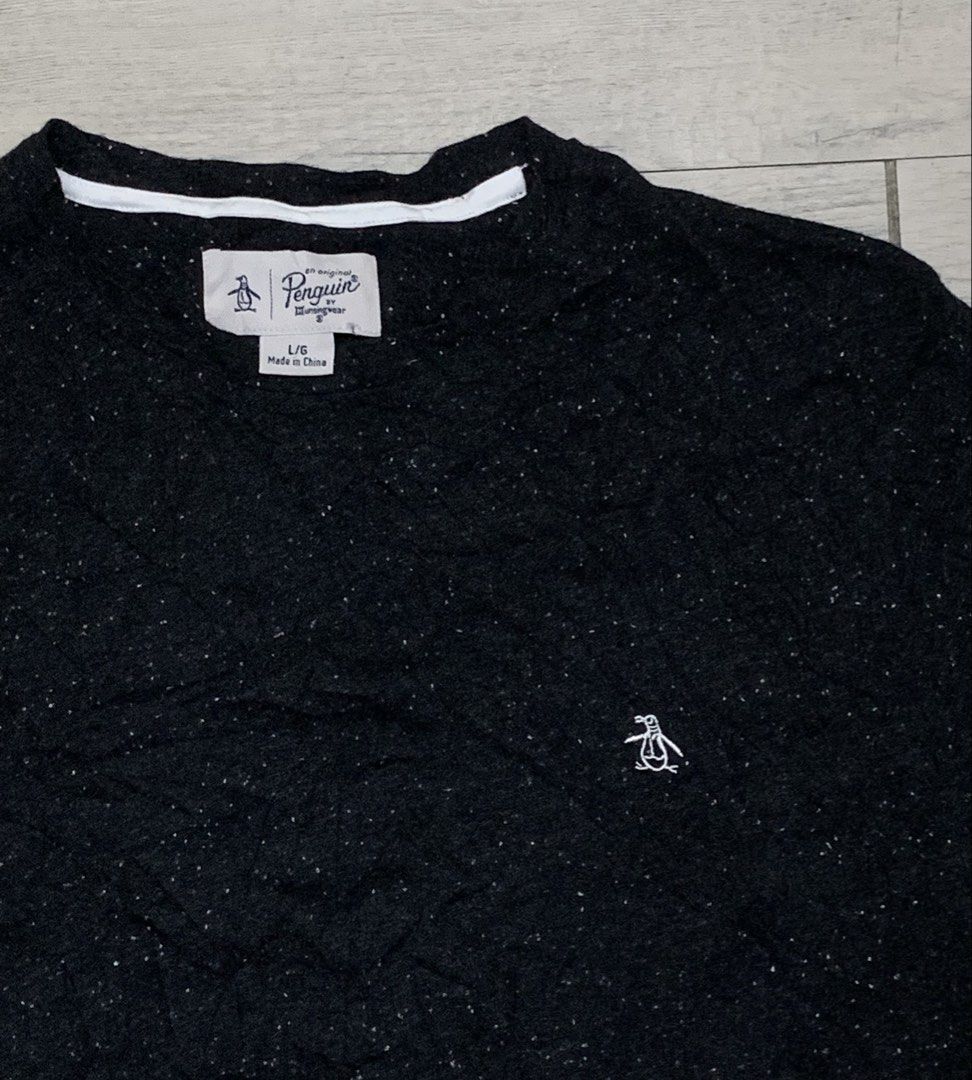 Penguin Shirt (Category: Activewear) located in Manila. Submitted by sgthriftmanila2.0 (Listing ID 1467064773, Image 2). Description: PTPA 🙏 The image shows a black speckled crewneck t-shirt by Original Penguin by Munsingwear with a small embroidered penguin logo on the chest. Size: Medium 20x29.5 Condition: like new Colorate: 9 or up/10 Made: China Issue: Need wash only DM 📥 Sucat, Paranaque city.