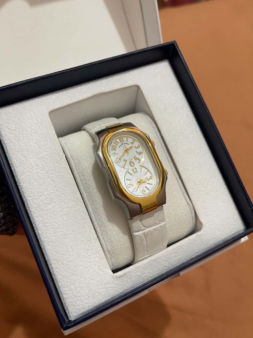 Philip Stein Dual Time Zone Watch Set (Category: Women's Watches) located in Pasay City. Submitted by ccpetitte (Listing ID 1466971678, Image 1). Description: - Authentic Philip Stein dual time watch - Elegant gold and silver-tone curved rectangular case - Includes 3 straps: white textured leather (attached), plus extra yellow and light blue straps - Comes with a dark blue travel pouch and official presentation box - Natural frequency technology 