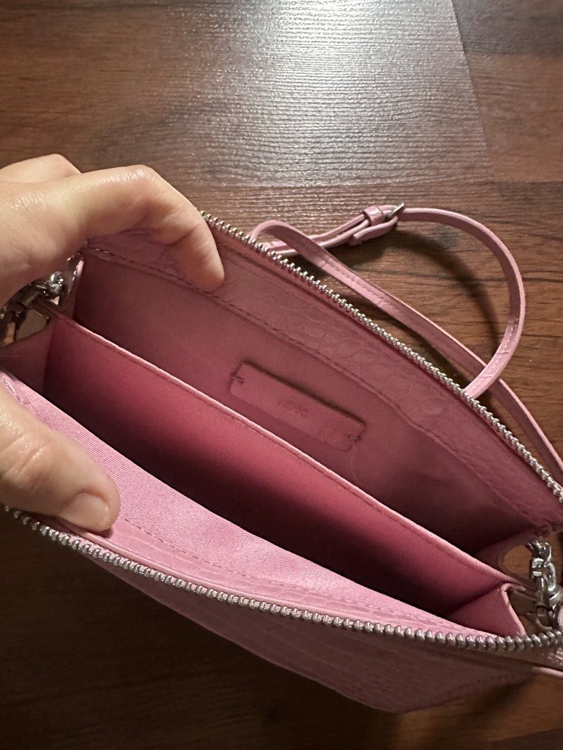 Pink Croc Embossed Double Zip Crossbody Bag with Chain (Category: Cross-body Bags) located in Binan City. Submitted by denchimmy (Listing ID 1466984530, Image 3). Description: - Trendy pink crossbody bag with a chic faux crocodile skin texture - Silver hardware and zippers with a clean pink fabric interior - Dual zipped compartments plus a convenient front exterior card slot - Ideal compact size to fit your phone, keys, and cards easily - Include