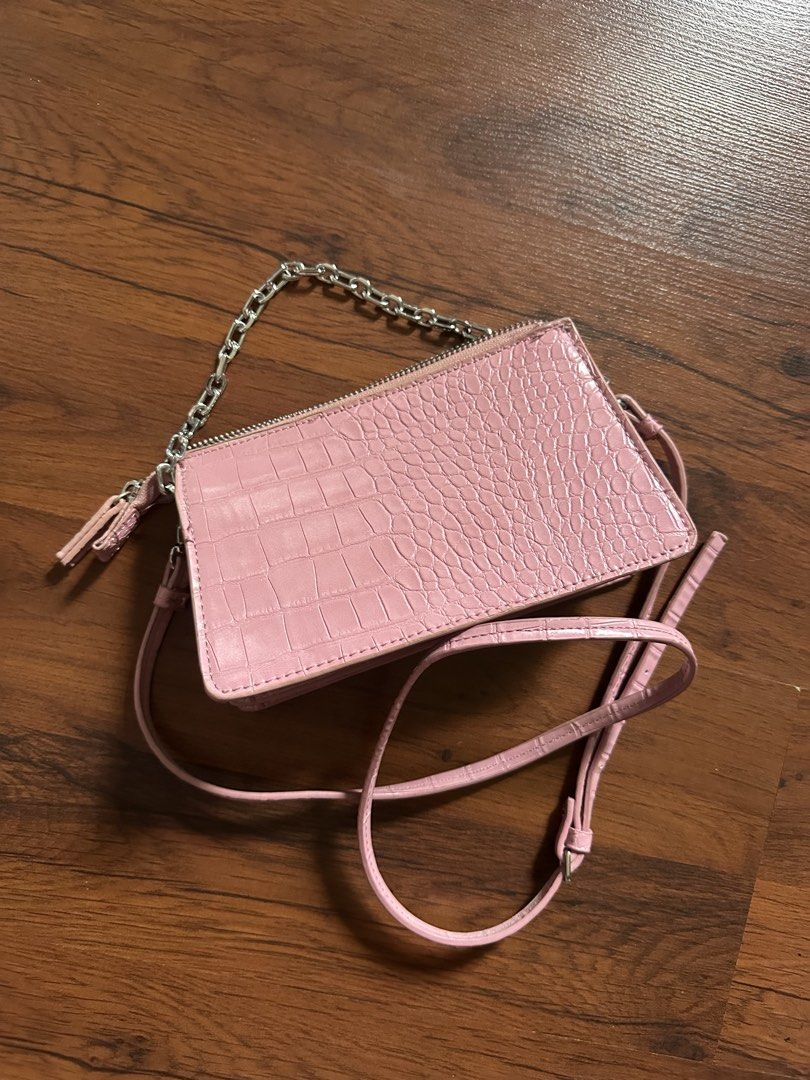 Pink Croc Embossed Double Zip Crossbody Bag with Chain (Category: Cross-body Bags) located in Binan City. Submitted by denchimmy (Listing ID 1466984530, Image 2). Description: - Trendy pink crossbody bag with a chic faux crocodile skin texture - Silver hardware and zippers with a clean pink fabric interior - Dual zipped compartments plus a convenient front exterior card slot - Ideal compact size to fit your phone, keys, and cards easily - Include
