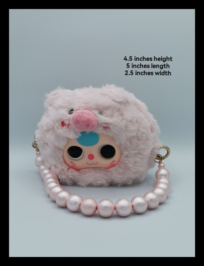 Pink Fluffy Plush Handbag with Pearl Strap (Category: Shoulder Bags) located in Malabon City. Submitted by restrapped88 (Listing ID 1467146300, Image 1). Description: - Adorable toy fuzzy pink pig design - Compact size: 4.5 inches (H) x 5 inches (L) x 2.5 inches (W) - With chunky pearl handstrap and secure zipper - Statement piece or gift.