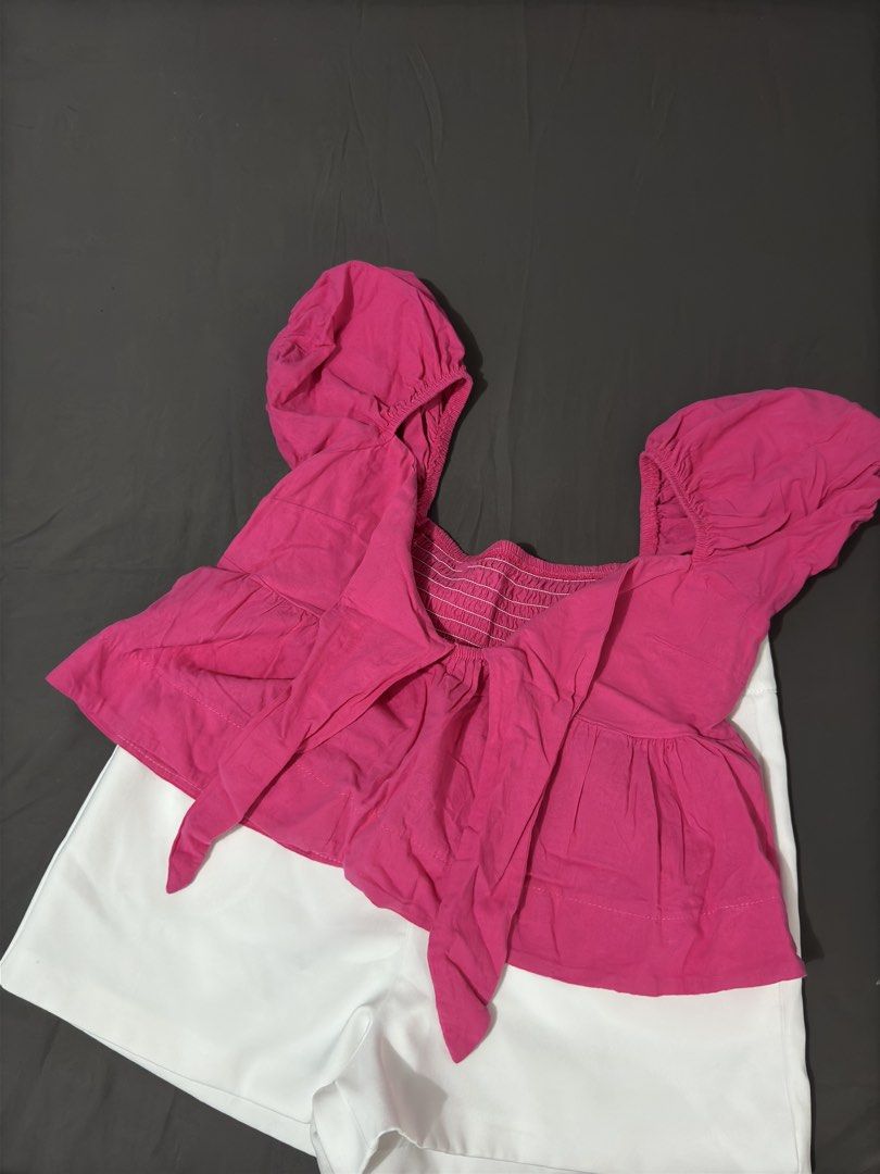Pink Puff Sleeve Tie Front Top (Category: Sets or Coordinates) located in Manila. Submitted by cleverturtle.1ace8b (Listing ID 1467085026, Image 2). Description: - Top details: Puff sleeves, square neckline, front tie, and comfortable smocked back panel - Shorts details: Smooth waistband and basic cut - Versatile: Wear as a set or mix and match with other pieces - Condition: Brand new/Mint - Perfect for: Warm weather, casual outings, and OOTDs - 