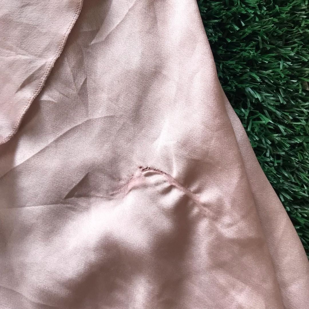 Pink Satin Skirt with Flawed Seam (Category: Skirts) located in Pili. Submitted by xi4cl0set (Listing ID 1467167649, Image 2). Description: - Color: Beautiful light pastel pink - Material: Smooth, silky satin fabric - Design: Features a clean rolled hem edge along the top fold - Styling: Versatile piece that easily pairs with casual tees or elegant blouses - Condition: Good overall, with a minor flaw/slight fray at the seam s-m MOD: Gcash, NO COD