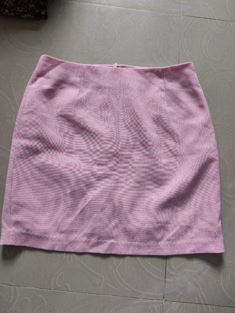 Pink Short Mini Skirt (Category: Skirts) located in Cabanatuan. Submitted by lyxyx (Listing ID 1467109665, Image 1). Description: - Color: Solid pink - Style: Clean simple cut with structured panels and flat waistband - Material: Textured fabric throughout - Versatility: Easy to pair with both casual tees and dressy blouses - Fit: Mini skirt length.