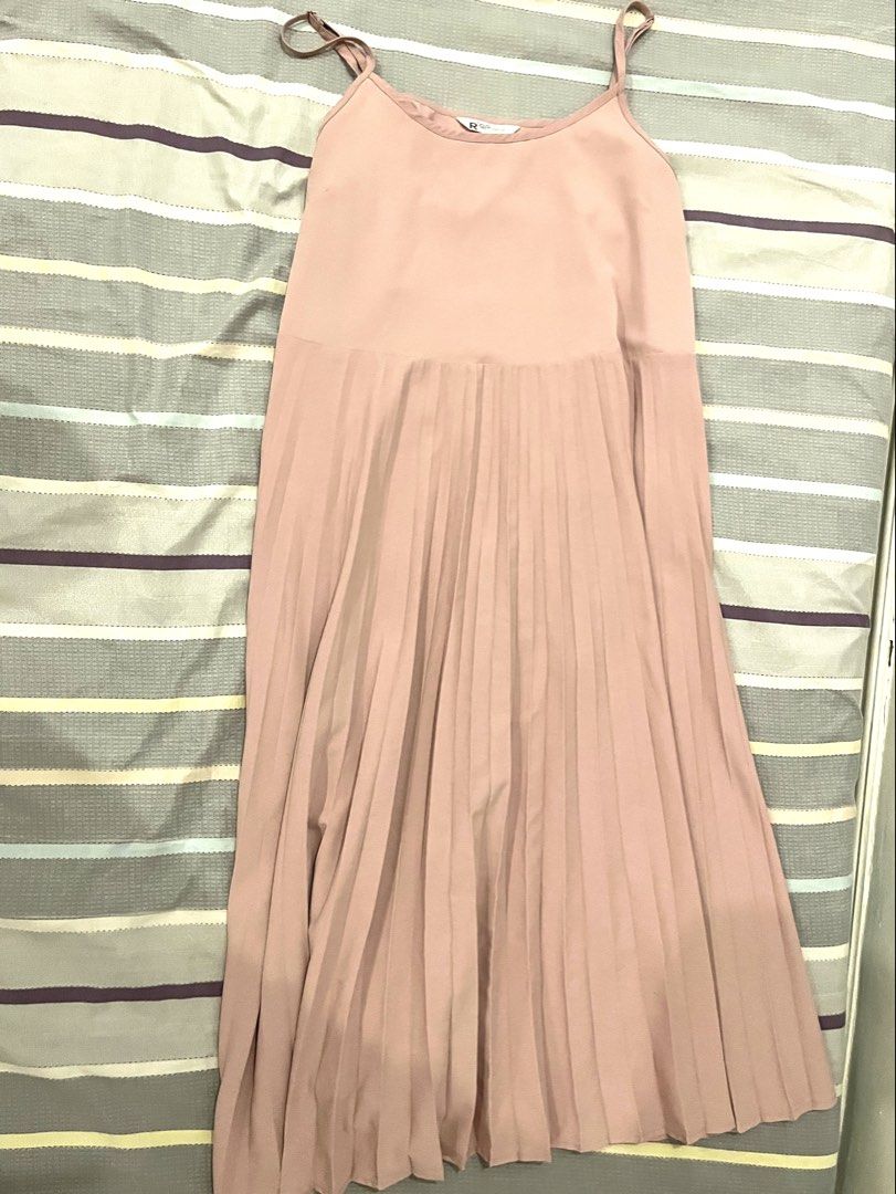 Pink Spaghetti Strap Pleated Maxi Dress (Category: Dresses) located in San Mateo. Submitted by smtyabl (Listing ID 1467117654, Image 3). Description: - Color: Dusty pink - Size: M- 2XL - Design: Round neckline with adjustable spaghetti straps - Fit: Relaxed fit through the body - Details: Lightweight fabric featuring a solid top and a textured pleated bottom half starting below the hip - Length: Midi to maxi length (depending on height).