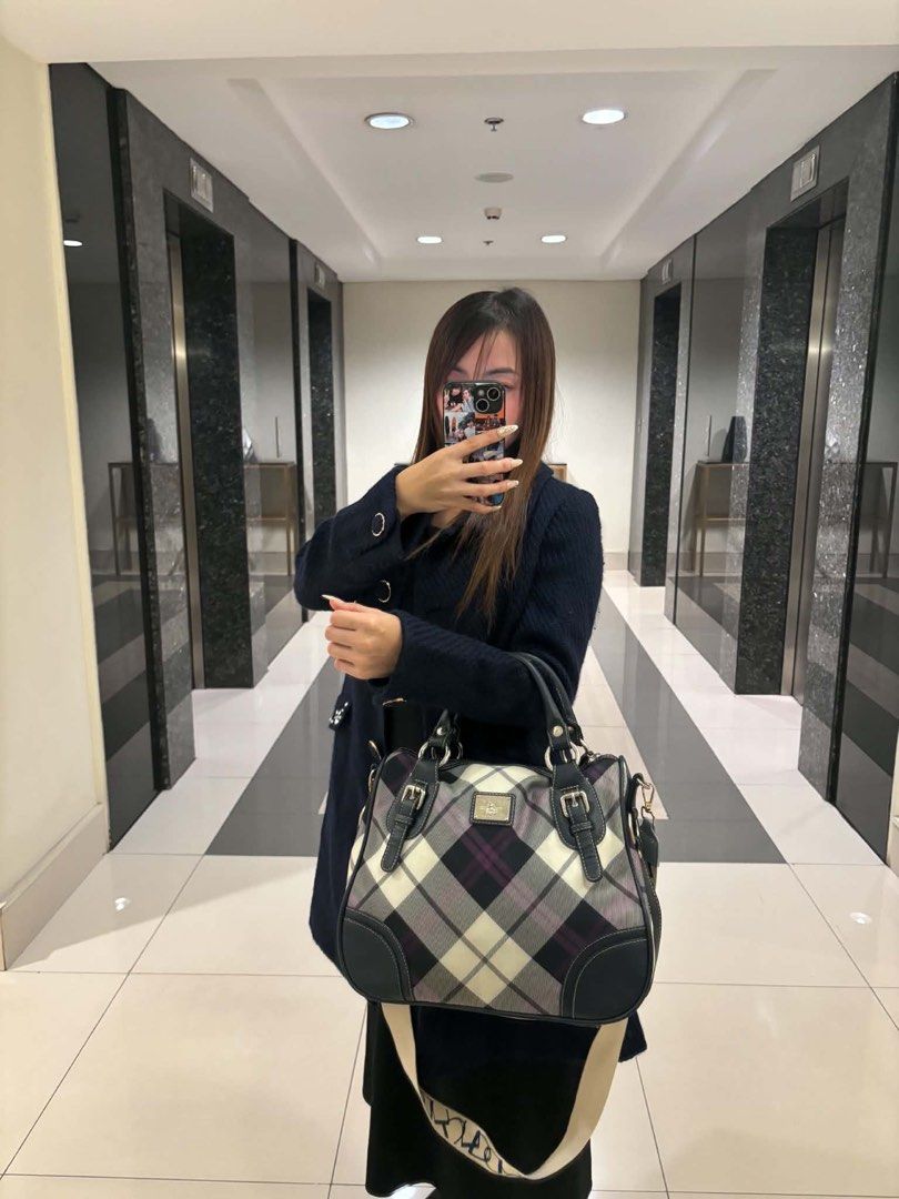 Plaid Satchel Handbag with Detachable Strap (Category: Tote Bags) located in Makati City. Submitted by bittersweet818ta (Listing ID 1467139927, Image 3). Description: - Striking plaid pattern in black, white, and purple tones - Durable dark faux leather trim with stylish front buckle accents - Secure zip-top closure to keep belongings safe - Versatile carrying options with handy top handles and a thick patterned canvas crossbody strap - Finished 