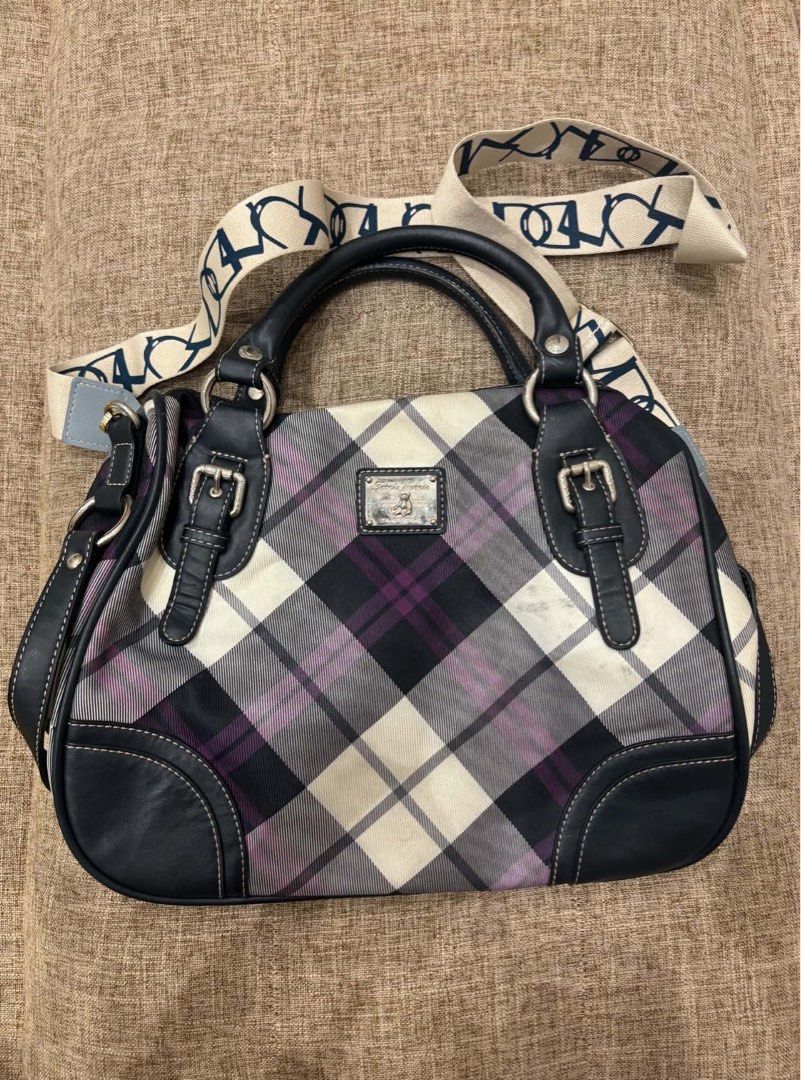 Plaid Satchel Handbag with Detachable Strap (Category: Tote Bags) located in Makati City. Submitted by bittersweet818ta (Listing ID 1467139927, Image 1). Description: - Striking plaid pattern in black, white, and purple tones - Durable dark faux leather trim with stylish front buckle accents - Secure zip-top closure to keep belongings safe - Versatile carrying options with handy top handles and a thick patterned canvas crossbody strap - Finished 