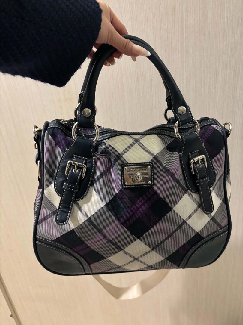 Plaid Satchel Handbag with Detachable Strap (Category: Tote Bags) located in Makati City. Submitted by bittersweet818ta (Listing ID 1467139927, Image 2). Description: - Striking plaid pattern in black, white, and purple tones - Durable dark faux leather trim with stylish front buckle accents - Secure zip-top closure to keep belongings safe - Versatile carrying options with handy top handles and a thick patterned canvas crossbody strap - Finished 