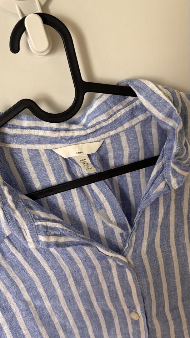 Plus Size H&M Linen Blue White Striped Button Down Shirt (Category: Tshirts & Polo Shirts ) located in Mandaluyong City. Submitted by decltqueen (Listing ID 1467002284, Image 2). Description: H&M blue and white striped linen shirt in Size XL on tag. Can fit till 3XL. Lightweight, breathable, and perfect for hot weather. Features a classic collar, front buttons, and 3/4 sleeves in a relaxed fit..