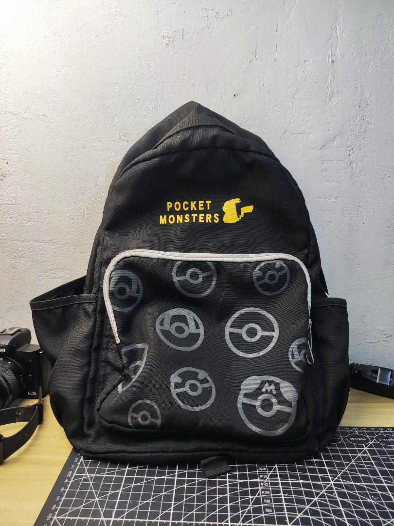 Pokémon Pocket Monsters Black Backpack (Category: Backpacks) located in Taytay. Submitted by iamdion30 (Listing ID 1466993715, Image 1). Description: - Authentic Japan Import: Comes with official tag inside - Design: Stylish black backpack with a front Poké Ball pocket, Pikachu silhouette, and yellow Pocket Monsters text PM for more details.