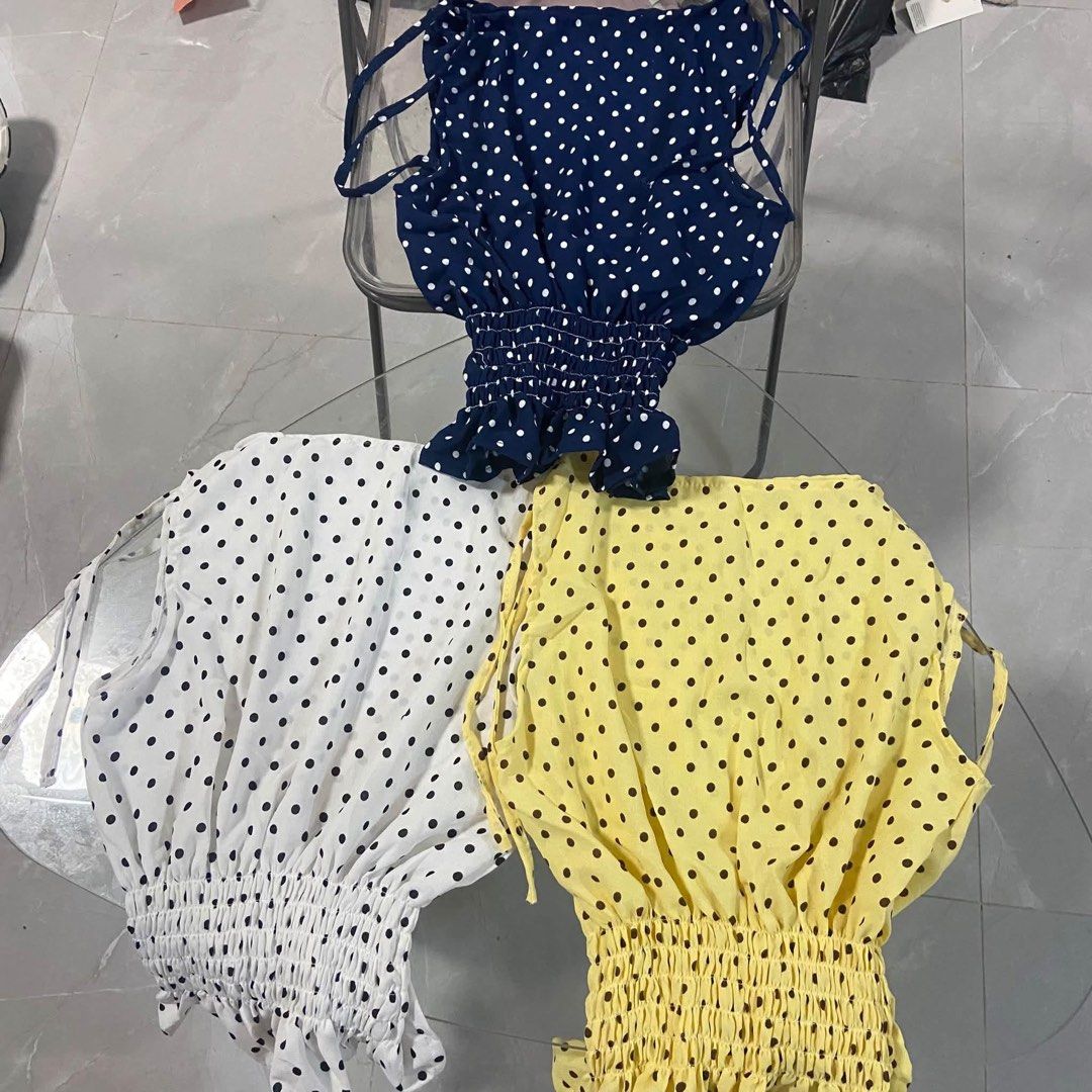 Polka dot smocked peplum halter top multiple colors (Category: Sleeveless) located in Pasacao. Submitted by eommacollections_ (Listing ID 1467072027, Image 3). Description: - Style: Cute polka dot halter top - Features: Smocked waist, ruffled hem, side zipper, and tie-up shoulder straps - Material: Lightweight fabric, ideal for casual summer days - Colors available: Maroon, yellow, white, and dark blue - Condition: Brand new, multiple pieces read