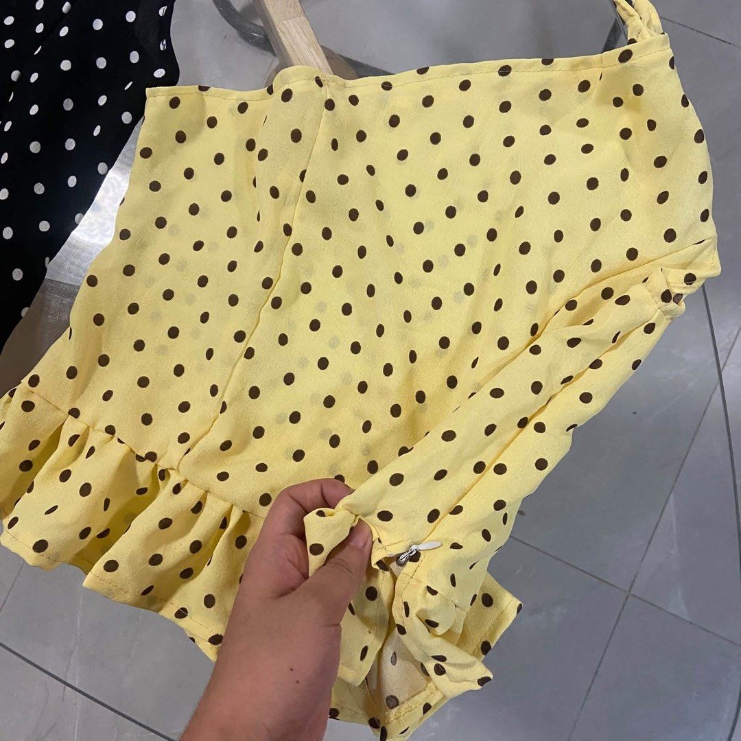 Polka dot smocked peplum halter top multiple colors (Category: Sleeveless) located in Pasacao. Submitted by eommacollections_ (Listing ID 1467072027, Image 2). Description: - Style: Cute polka dot halter top - Features: Smocked waist, ruffled hem, side zipper, and tie-up shoulder straps - Material: Lightweight fabric, ideal for casual summer days - Colors available: Maroon, yellow, white, and dark blue - Condition: Brand new, multiple pieces read