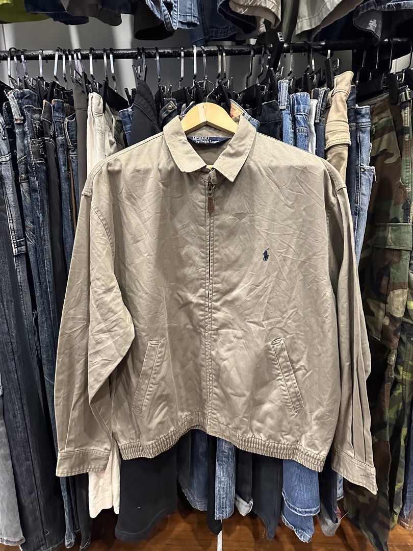 Polo by Ralph Lauren Khaki Zip-Up Jacket (Category: Coats, Jackets and Outerwear) located in Makati City. Submitted by hehehekdeg (Listing ID 1467029310, Image 1). Description: - Harrington Polo by Ralph Lauren - Color: Classic Khaki - Material: 100% sturdy cotton - Size: Tag size 100 - Details: Full zip with leather pull, pointed collar, side welt pockets, ribbed hem - Logo: Embroidered pony on left chest - Condition: Pre-loved, well-maintained.