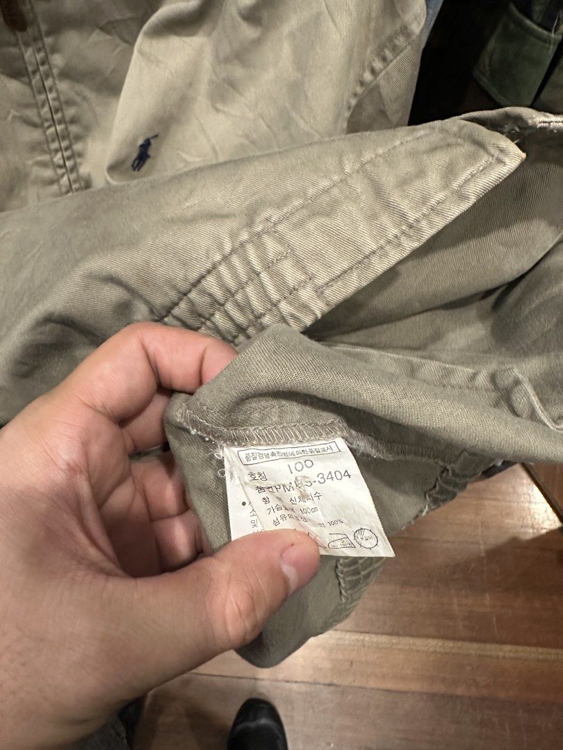 Polo by Ralph Lauren Khaki Zip-Up Jacket (Category: Coats, Jackets and Outerwear) located in Makati City. Submitted by hehehekdeg (Listing ID 1467029310, Image 3). Description: - Harrington Polo by Ralph Lauren - Color: Classic Khaki - Material: 100% sturdy cotton - Size: Tag size 100 - Details: Full zip with leather pull, pointed collar, side welt pockets, ribbed hem - Logo: Embroidered pony on left chest - Condition: Pre-loved, well-maintained.