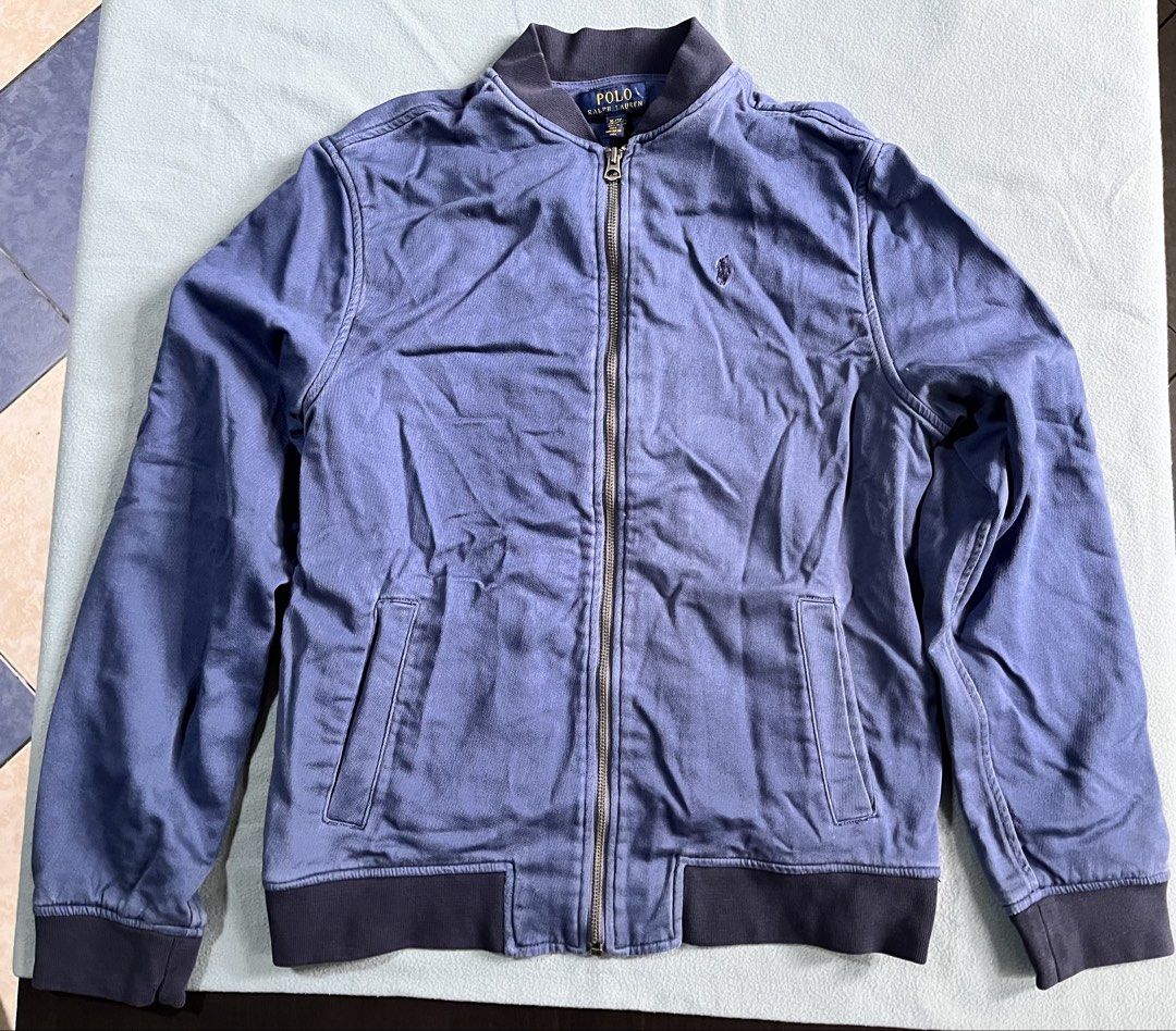 Polo Ralph Lauren Blue Bomber Jacket XL (Category: Coats, Jackets and Outerwear) located in Manila. Submitted by sunshineapril (Listing ID 1466979183, Image 1). Description: - Brand: Polo Ralph Lauren - Style: Zip-up bomber jacket - Color: Blue - Size: XL - Details: Ribbed collar, cuffs, and hem; full metal front zipper; two front hand pockets; signature embroidered pony logo on chest - Origin: Made in India - Condition: Great casual everyday out