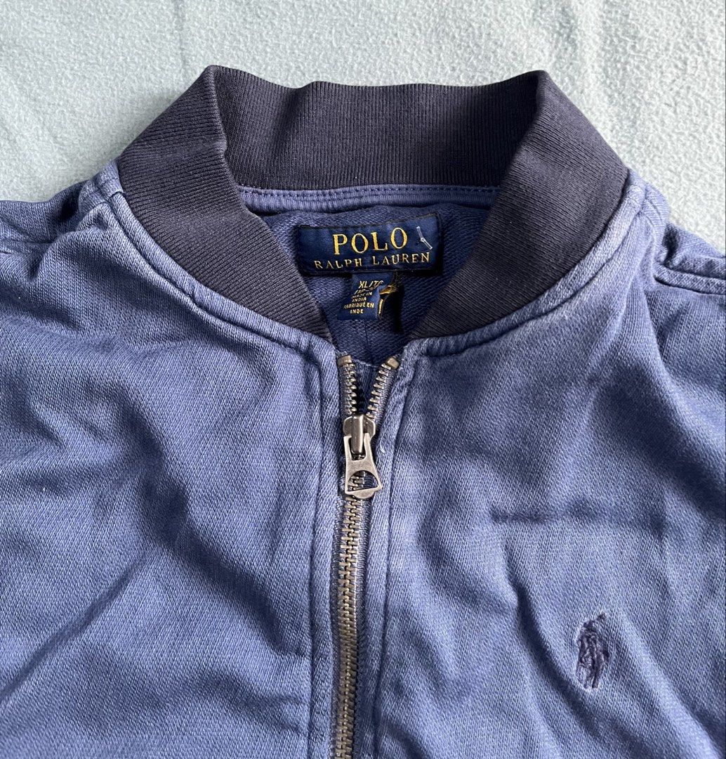 Polo Ralph Lauren Blue Bomber Jacket XL (Category: Coats, Jackets and Outerwear) located in Manila. Submitted by sunshineapril (Listing ID 1466979183, Image 3). Description: - Brand: Polo Ralph Lauren - Style: Zip-up bomber jacket - Color: Blue - Size: XL - Details: Ribbed collar, cuffs, and hem; full metal front zipper; two front hand pockets; signature embroidered pony logo on chest - Origin: Made in India - Condition: Great casual everyday out