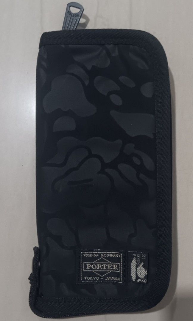 PORTER x BAPE Long Wallet (Category: Wallets & Card Holders) located in Cagayan de Oro. Submitted by purewater-af1910 (Listing ID 1467126760, Image 1). Description: Porter × A Bathing Ape ( BAPE ) Black Camu as new condition dimesion: 4 inch width 8 inch width 10/10 color rate Authentic/ Original Made in Japan negotible price Loc. Cagayan De Oro City Mindanao.