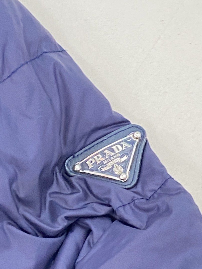 Prada puffer jacket triangle logo (Category: Luxury Apparel) located in Muntinlupa City. Submitted by twoangels.11.14.2023 (Listing ID 1466989913, Image 2). Description: Prada puffer jacket Size 42 Triangle logo shoulder Like new.