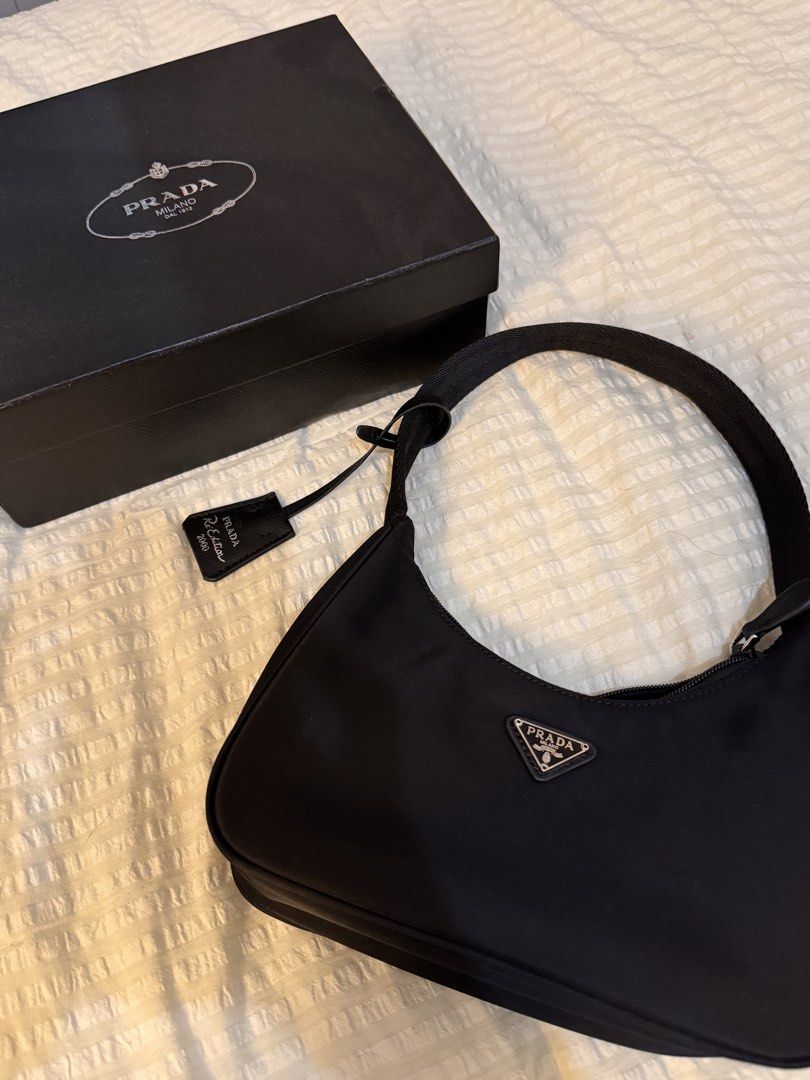 PRADA Re-Edition 2000 Black Shoulder Bag (Category: Luxury Bags & Wallets) located in Manila. Submitted by cgyu._ (Listing ID 1467108034, Image 1). Description: brand new ♡ not auth , comes with box ₱2500 only very good quality, always told na its exactly like the real one selling bc im in need of funds :( would keep if i could :(( 🏷️prada mini handbag black nylon shoulder bag.