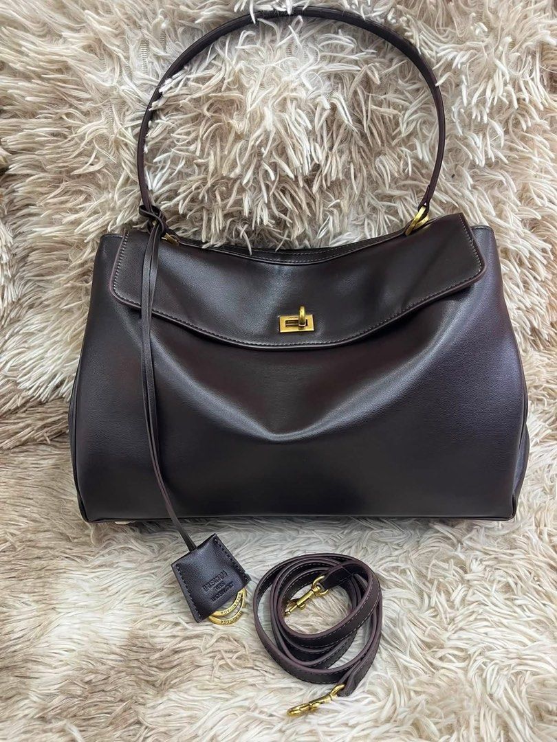 Preloved Balenciaga Rodeo Handbag Brown (Category: Luxury Bags & Wallets) located in Manila. Submitted by bagsandmanymanymore1 (Listing ID 1467077653, Image 1). Description: - Preloved Rodeo Leather Bag - Model: Rodeo Bag -Size 40cm - Color: Dark Brown - Material: Premium Leather - Hardware: Gold-tone - Closure: Front flap with twist lock - Features: Top handle, detachable shoulder strap, and leather tag charm - Interior: Multiple compartments an